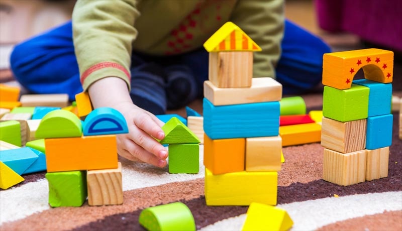 Children engaged in creative play and arts at Little Kickers Nursery